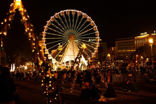 Christmas market at night with ferris wheel Lisbon stock image
