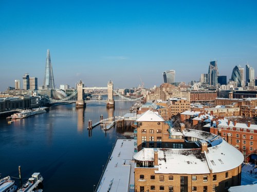 London sunny day with snow view of bridge and river